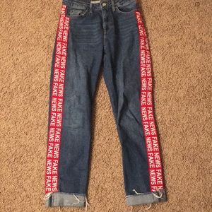 Topshop "fake news" jeans.
